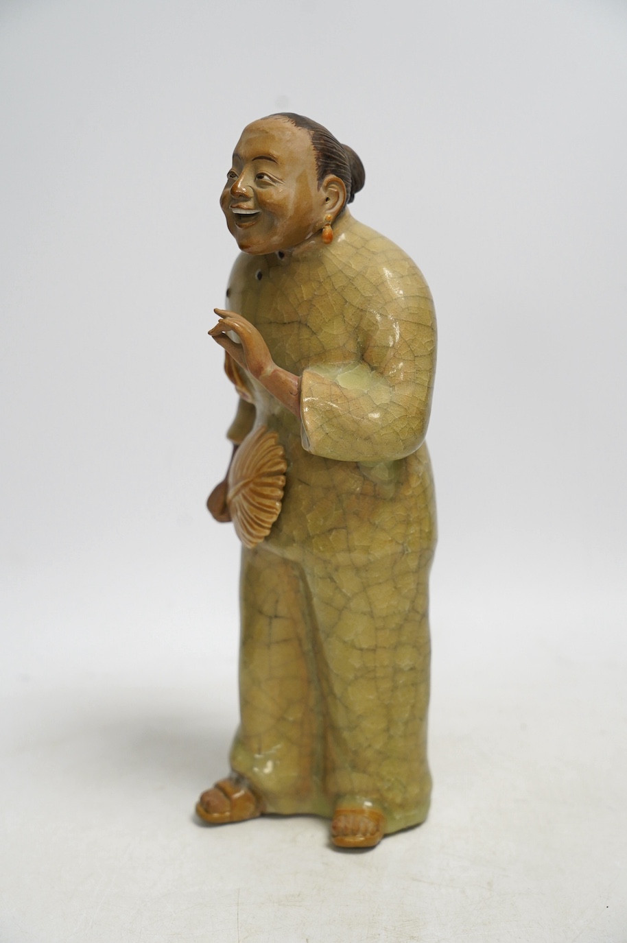 A Chinese Shiwan figure of a woman, mid 20th century, with box, 28cm high. Condition - poor to fair